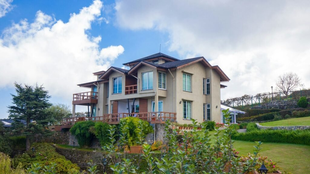 Boutique hill hotel with balconies and garden lawn