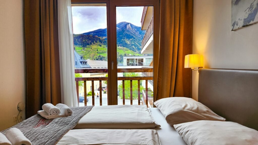 Hotel room with balcony and mountain view